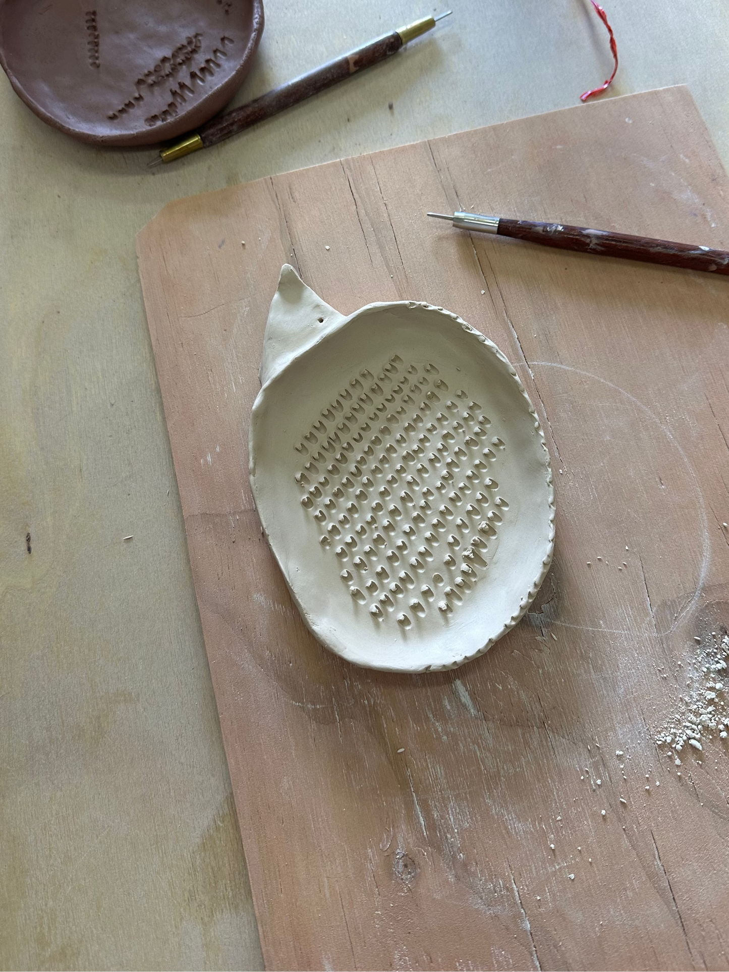 Handmade ceramic garlic grater in the shape of a hedgehog.