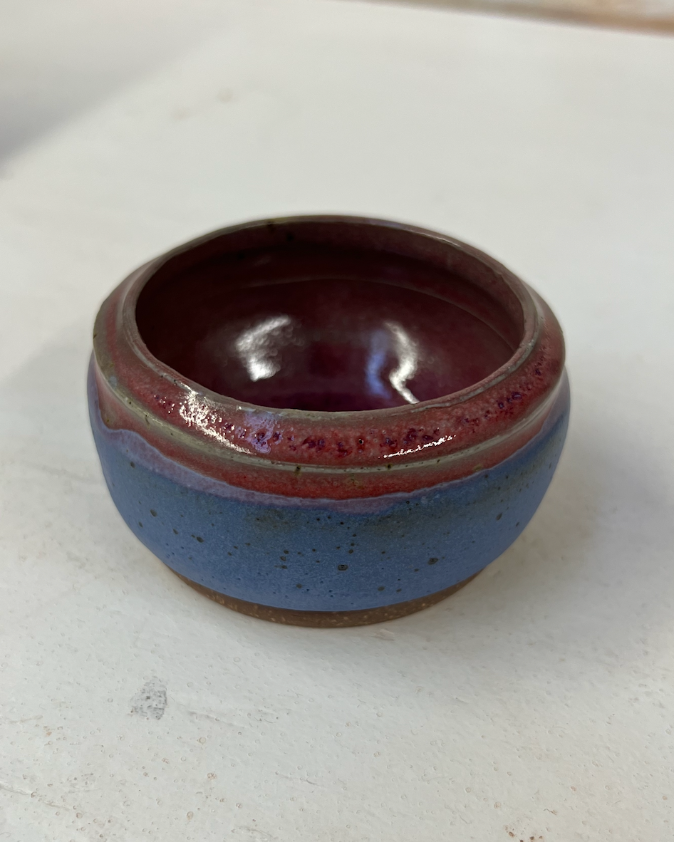 Ceramic bowl with a two-tone design on a white surface